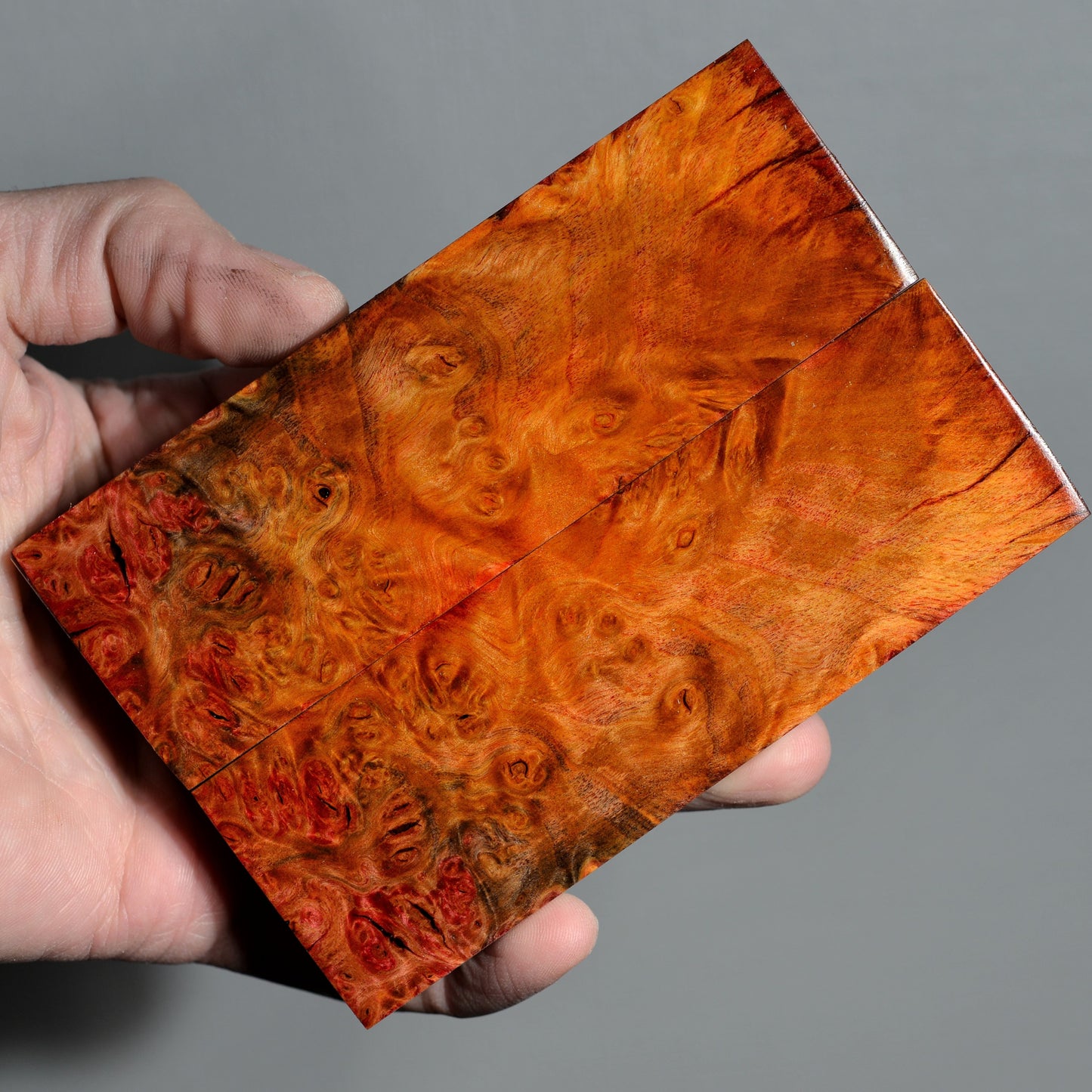 Stabilized alder burl knife handle scales with warm amber and brown figured grain, handmade wood material