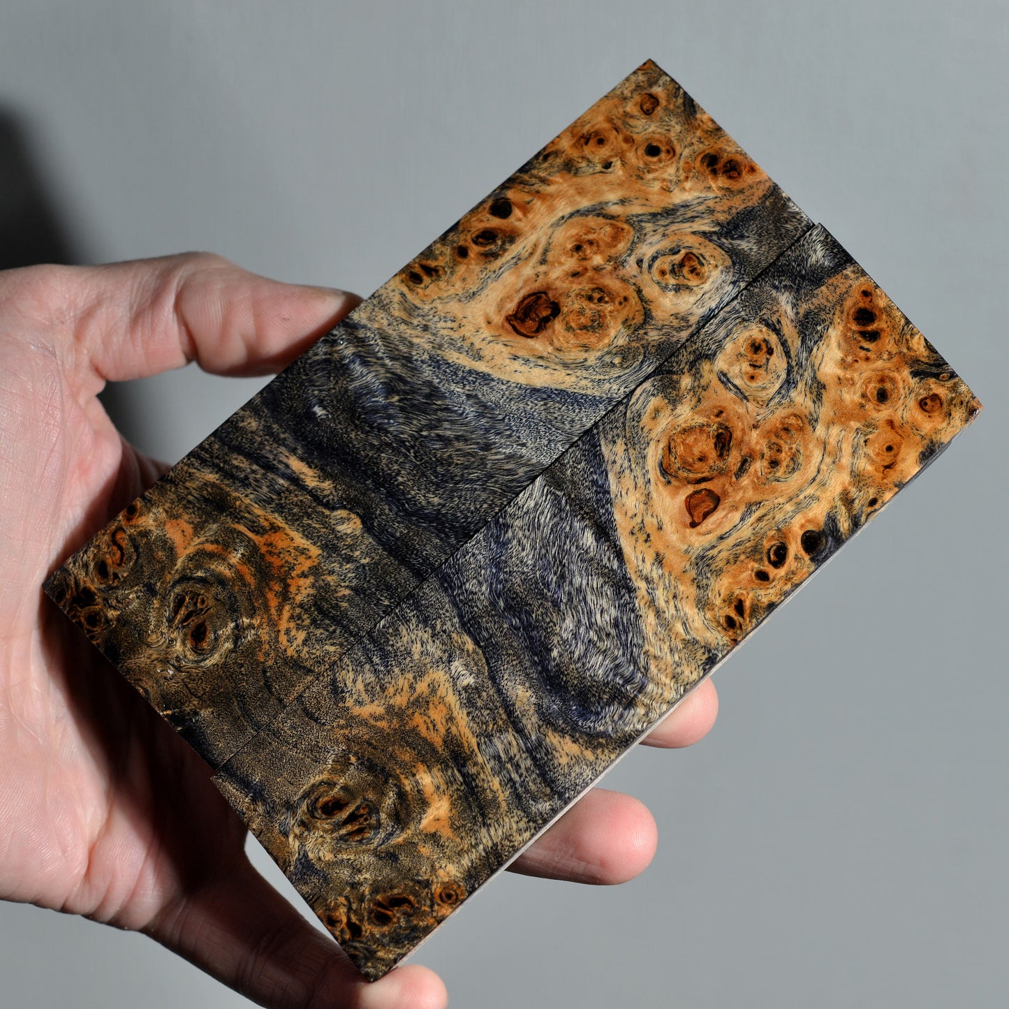 Stabilized poplar burl knife handle scales with rich brown and dark grain, handmade wood material