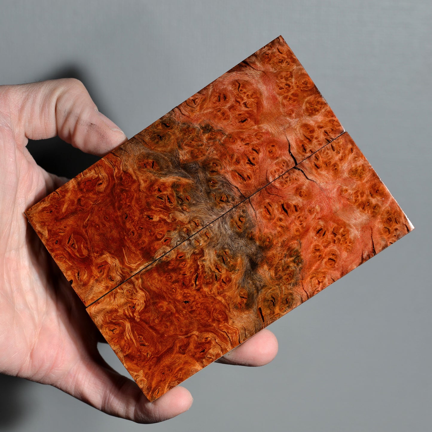 Stabilized red burl knife handle scales with rich figured grain and warm brown tones, handmade premium wood