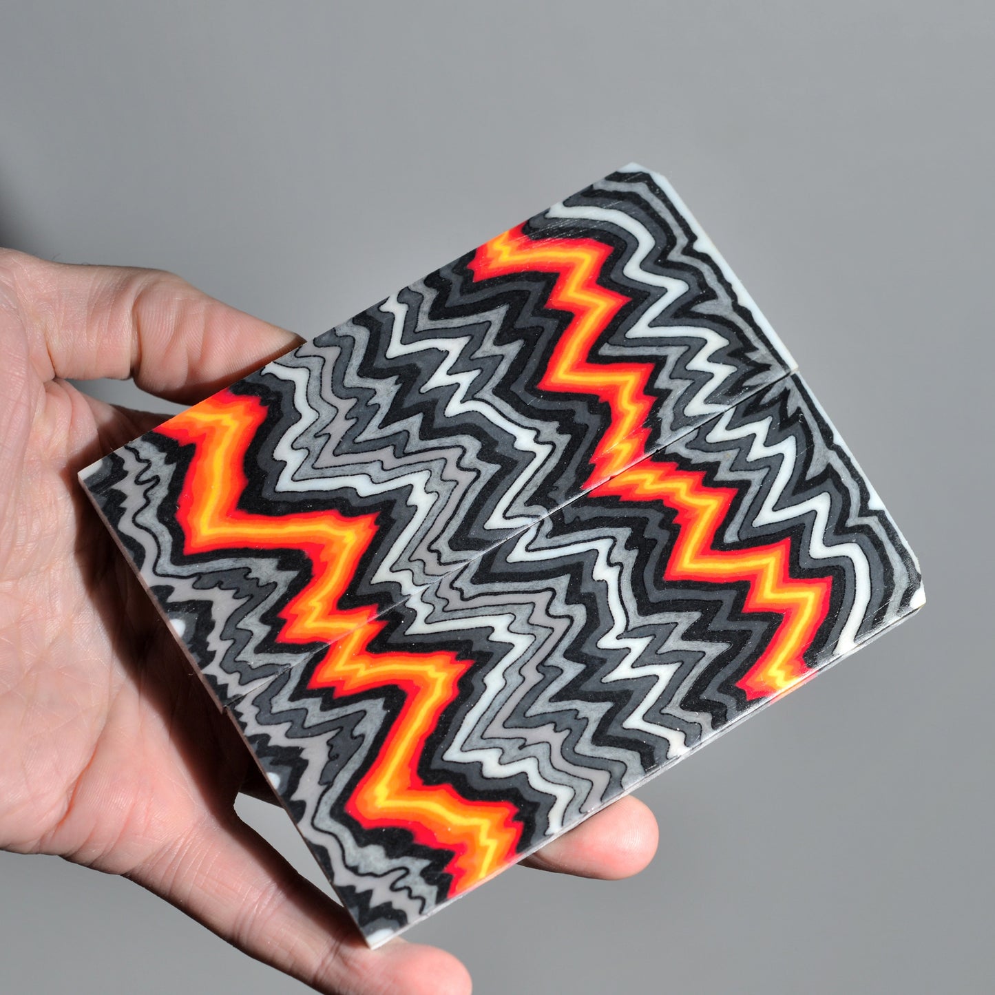 Handmade micarta-style composite handle scales in gray and neon orange colors for custom knife making #05