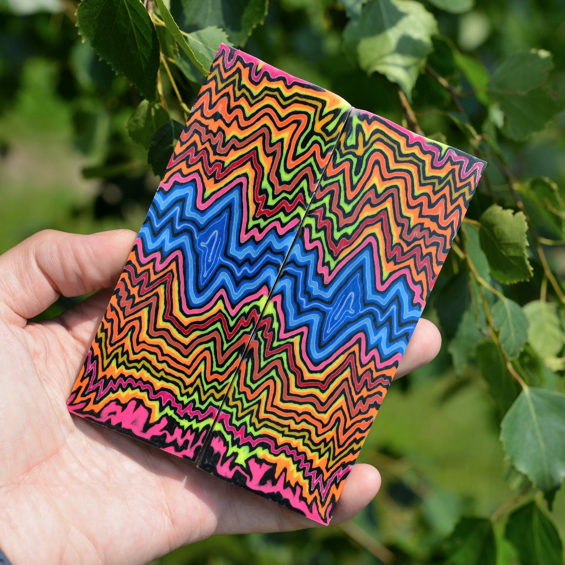 Handmade multicolor micarta handle material with vibrant trippy wave patterns for professional knife making and custom handles.