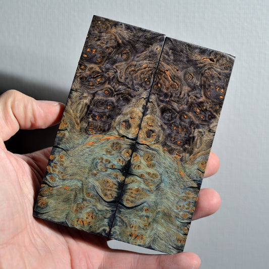 Bookmatched pair of stabilized Alder Burl knife handle scales featuring a unique blend of natural brown, vibrant orange, and deep teal blue burl figure.