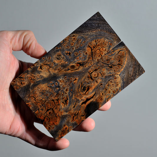 Stabilized elm burl handle scales featuring deep earthy colors, cracked burl texture and strong organic contrast.