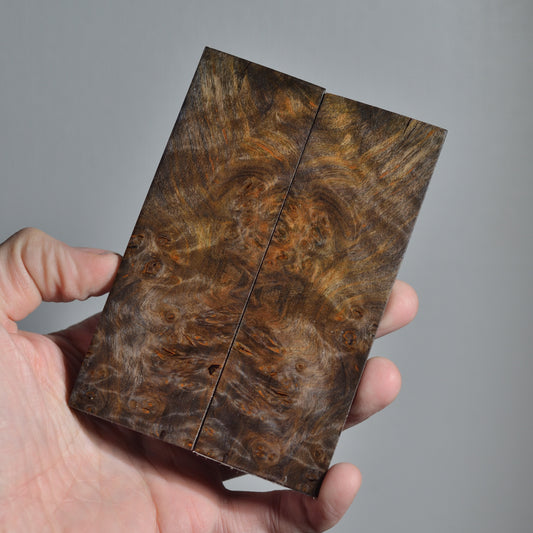 Bookmatched pair of stabilized wood knife scales with brown and copper burl texture